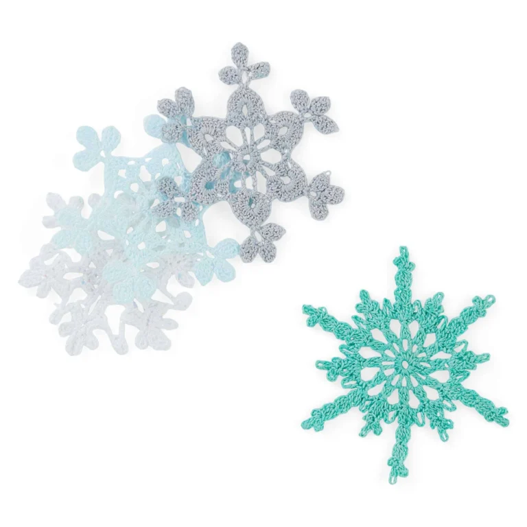Twinkling Snowflakes crochet pattern by Aunt Lydia showcasing intricate snowflake designs.