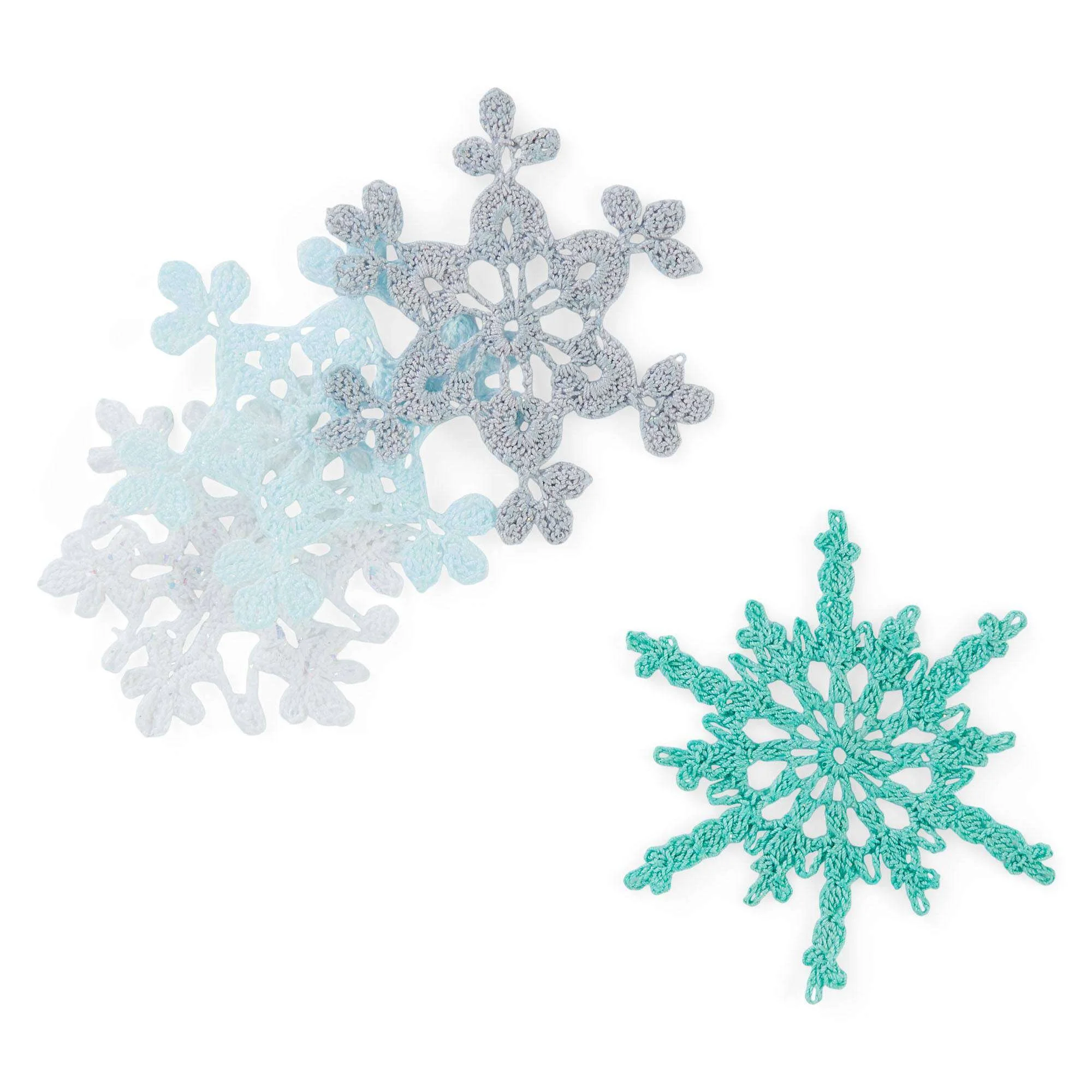 Twinkling Snowflakes crochet pattern by Aunt Lydia showcasing intricate snowflake designs.